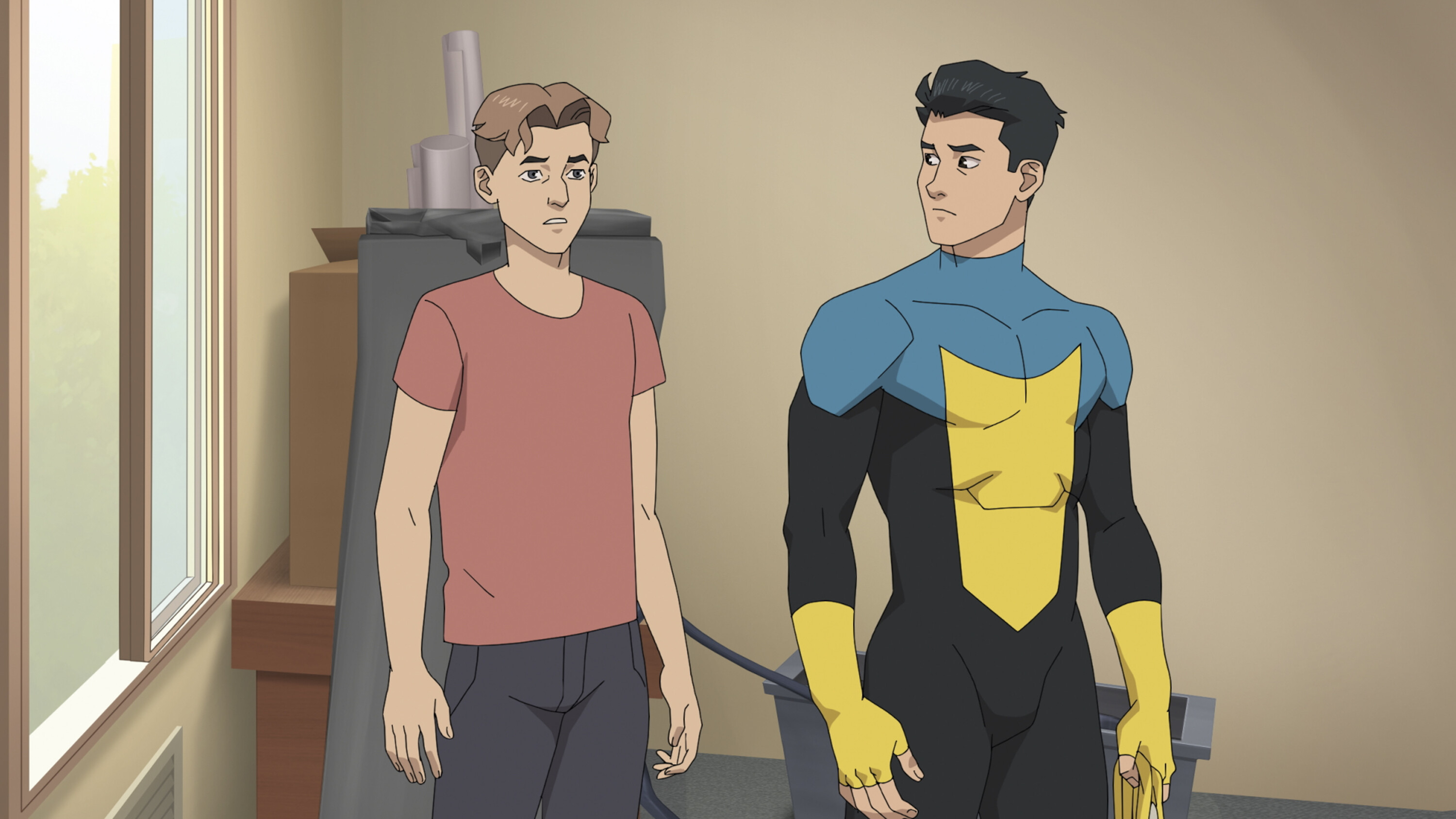 Mark Grayson and his superhero father, Nolan, from the animated series Invincible, standing in a room