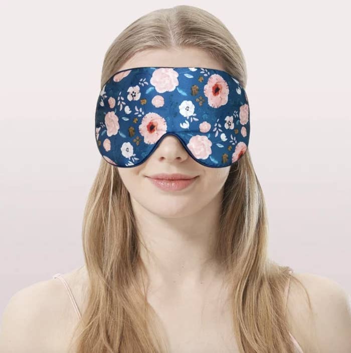 model wearing a floral sleep mask, suitable for a comfortable sleep