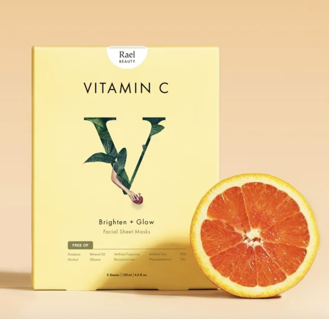 Packaging of Rael Beauty Vitamin C facial sheet masks with an orange slice beside it