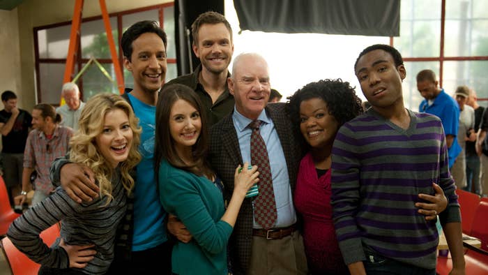 Cast of &quot;Community&quot; posing together with smiles in a behind-the-scenes group photo