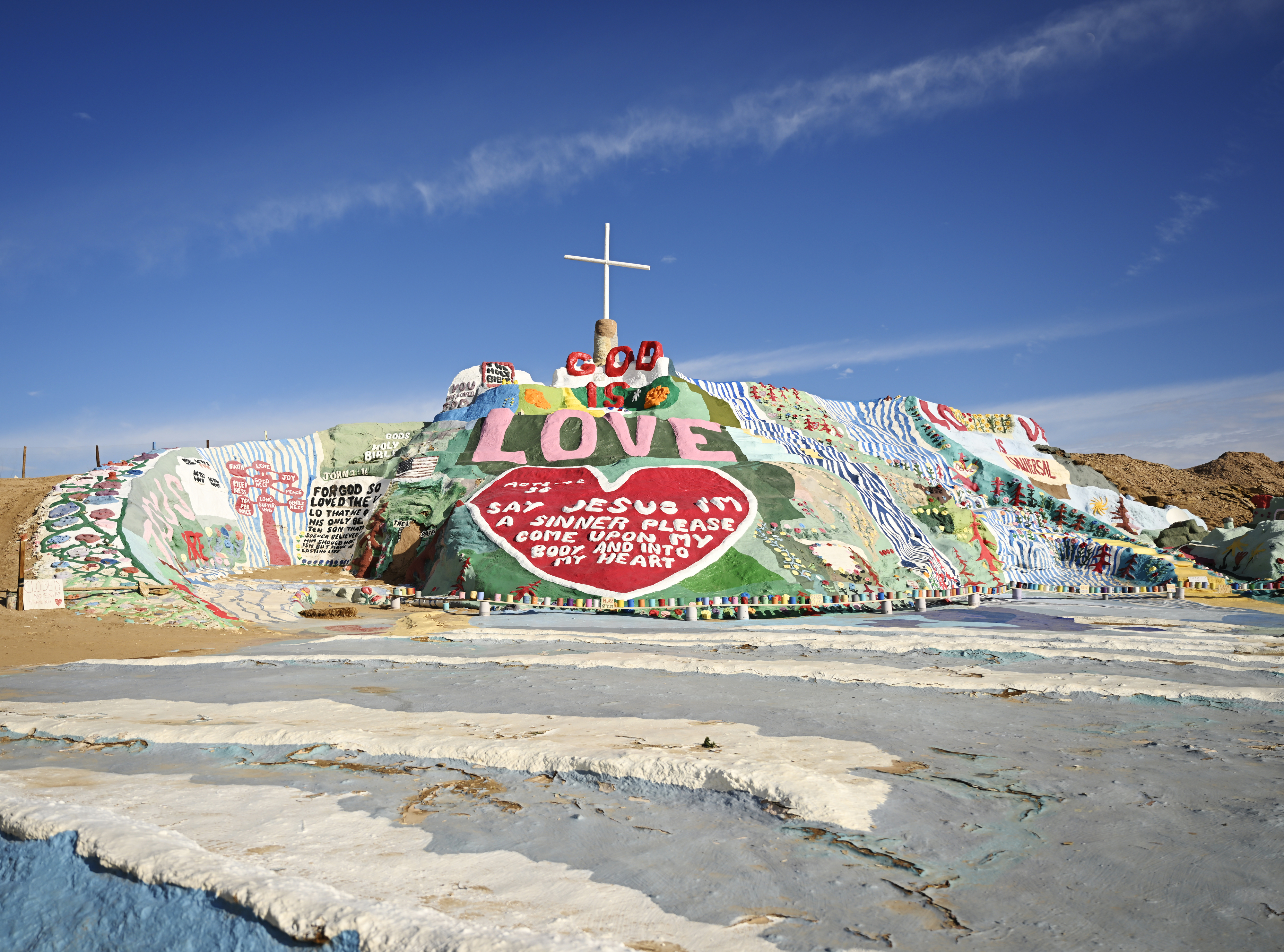 Salvation Mountain artistic landmark with religious and philosophical messages painted on a hill