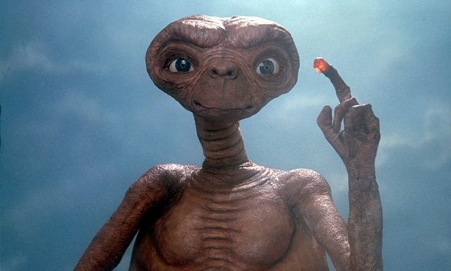 E.T. the Extra-Terrestrial character holding up a glowing finger