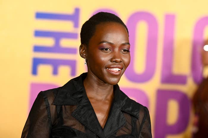 Lupita Nyong&#x27;o smiles in a sheer top at &#x27;The Color Purple&#x27; event