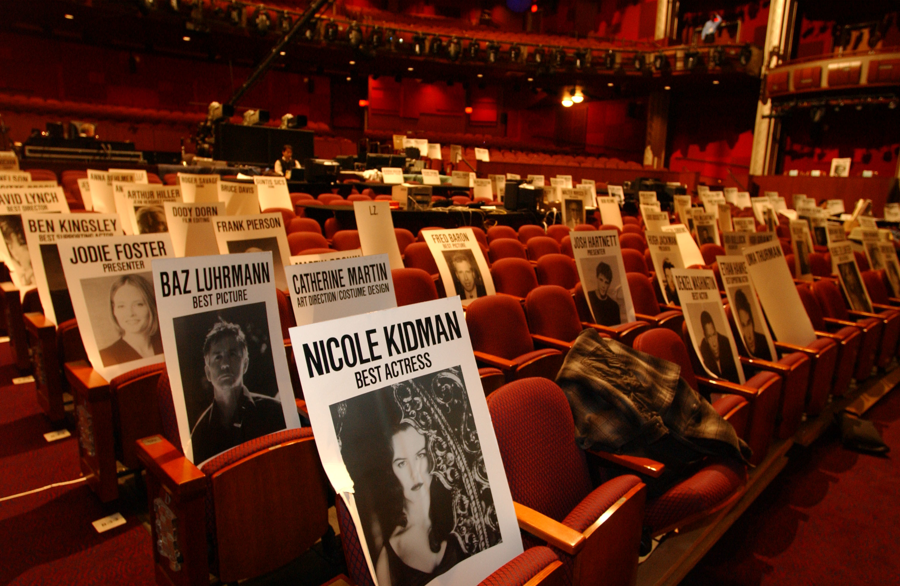 Theater seats with reserved signs for celebrities like Nicole Kidman for an awards event