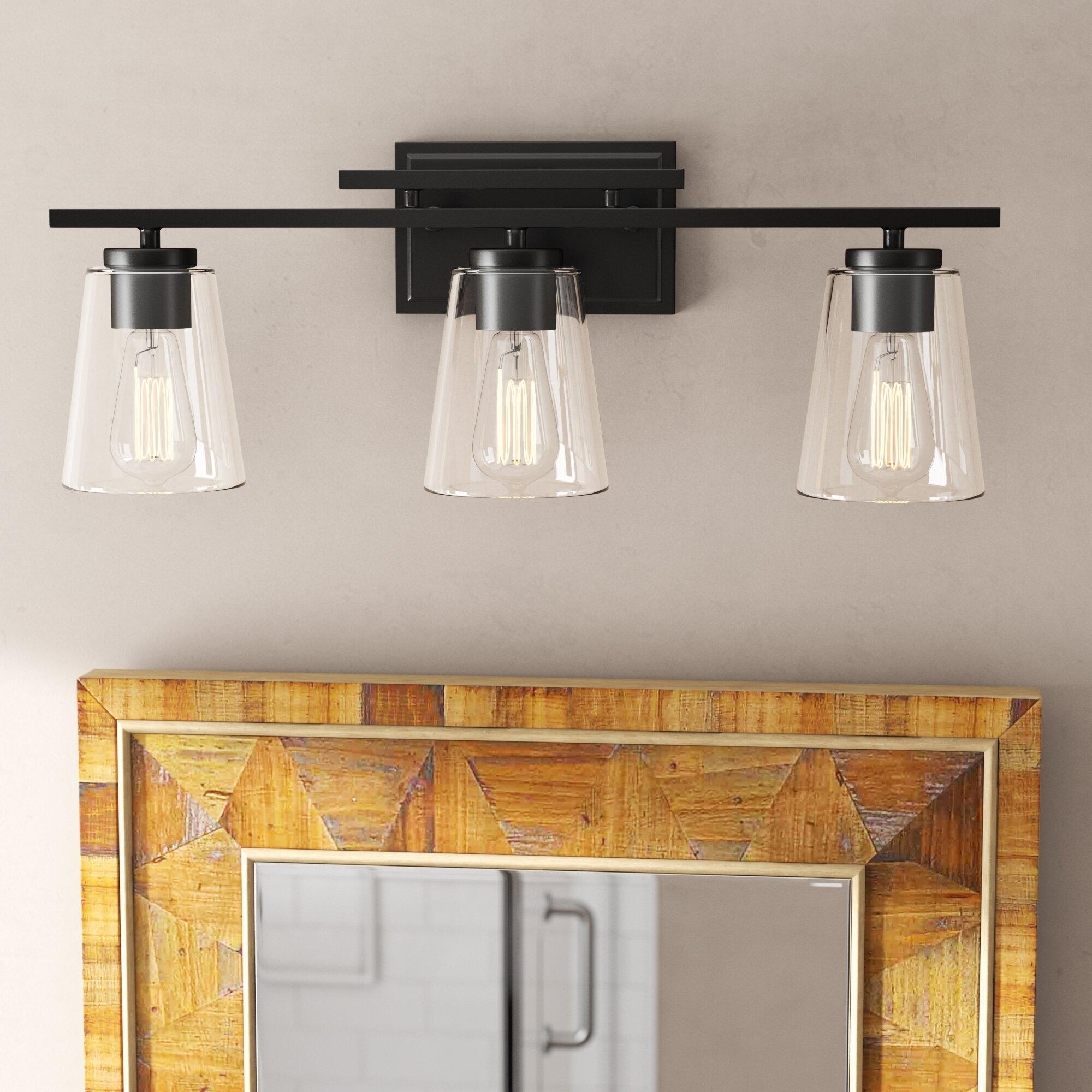 Wall-mounted lighting fixture with three glass shades