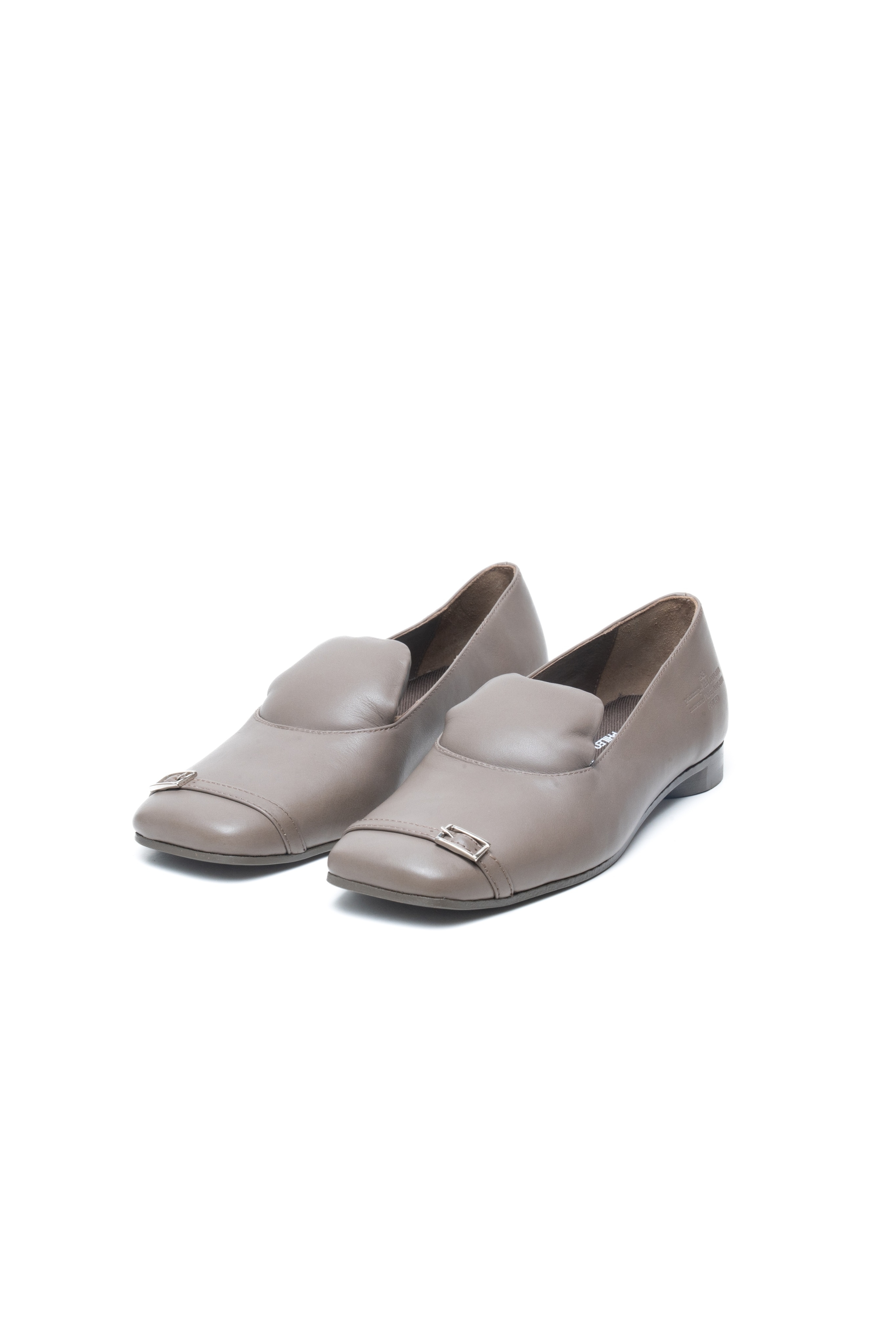 A pair of elegant flat shoes with a metallic buckle detail