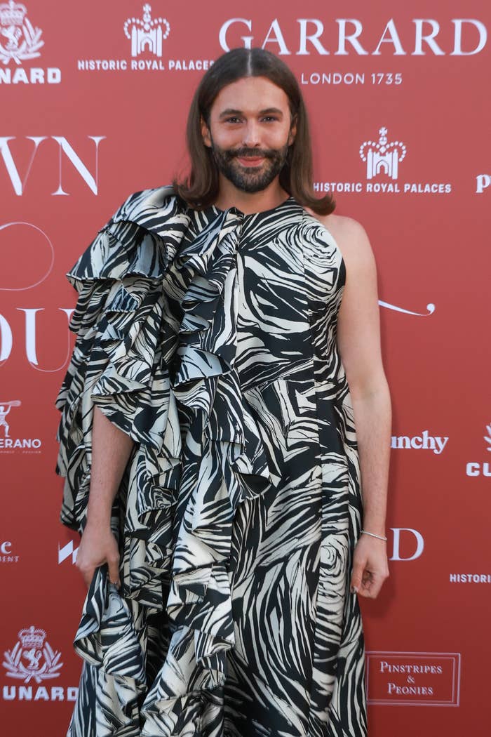 Jonathan Van Ness in a  patterned gown on the red carpet