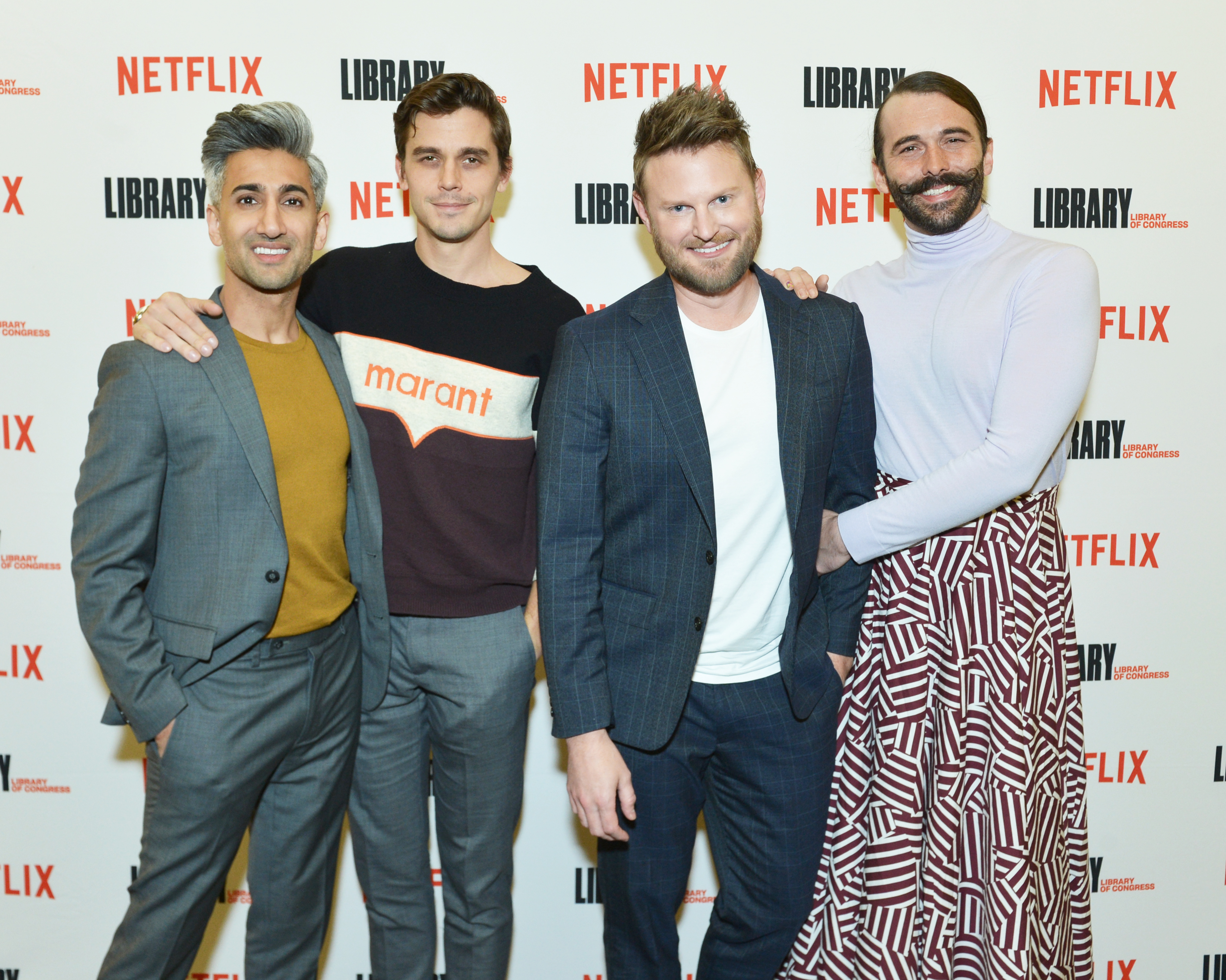Four cast members from Queer Eye posing together at a Netflix event