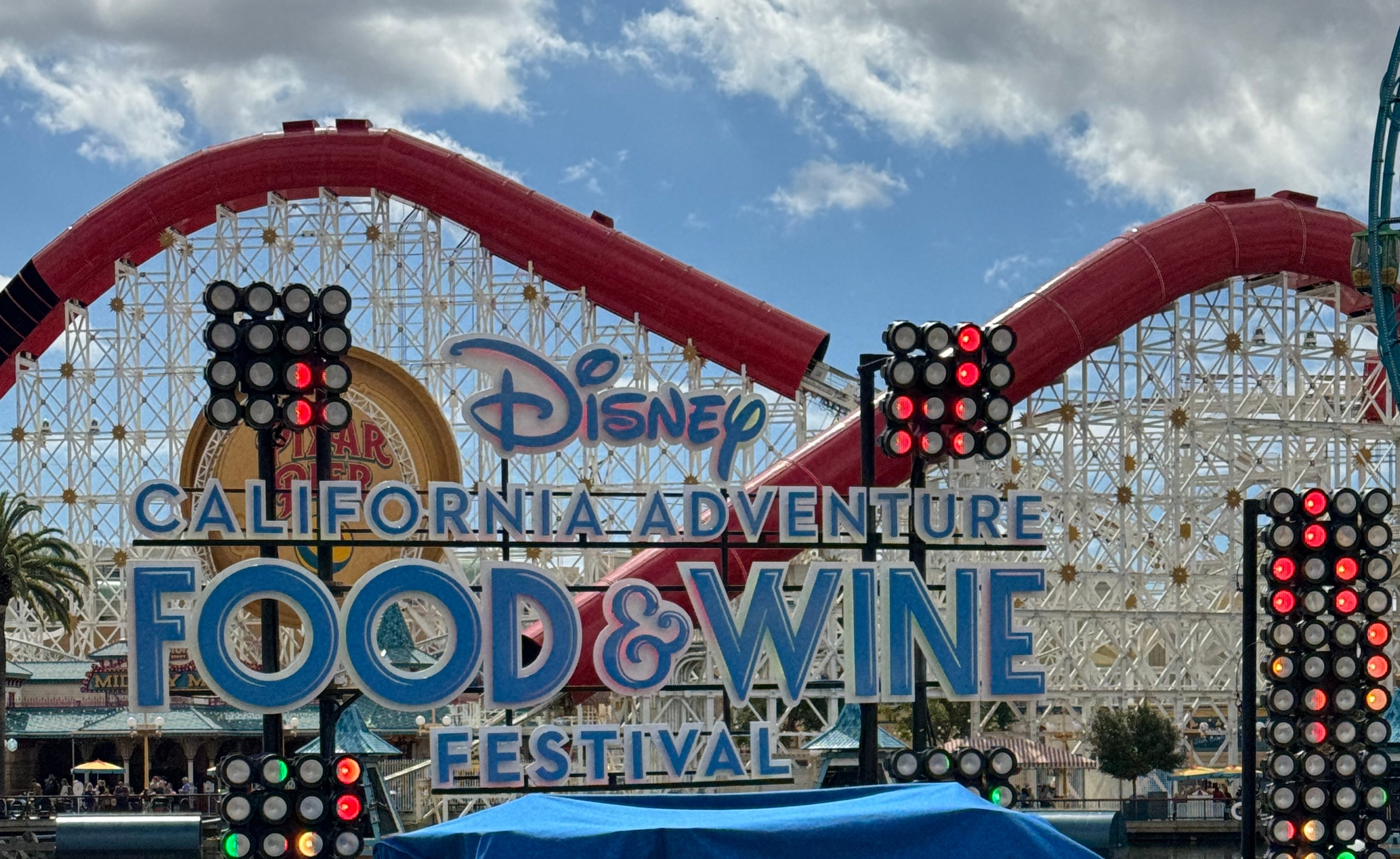 Stage at Disney California Adventure Food &amp;amp; Wine Festival with covered equipment in front
