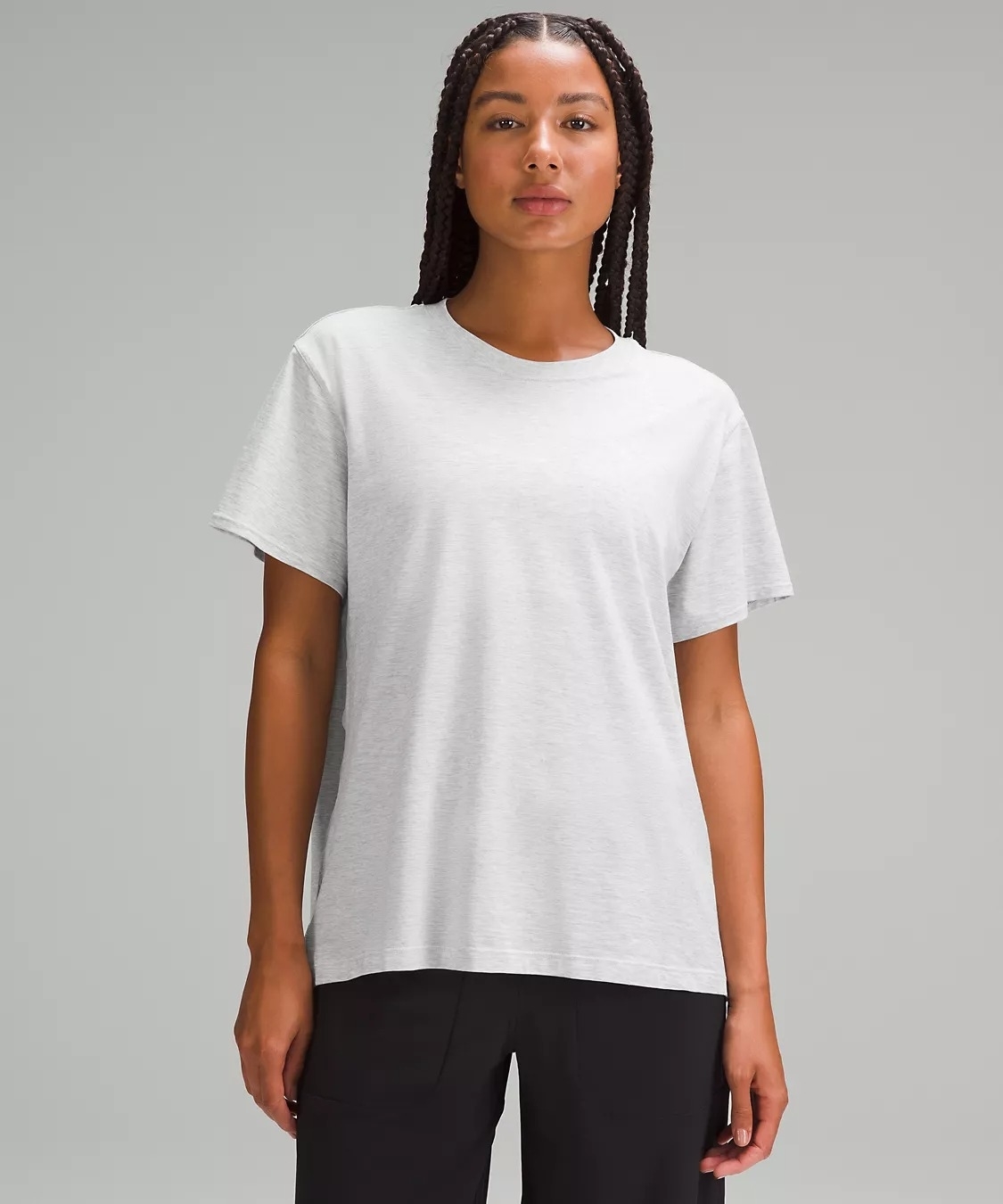 Model wearing light gray cotton T-shirt