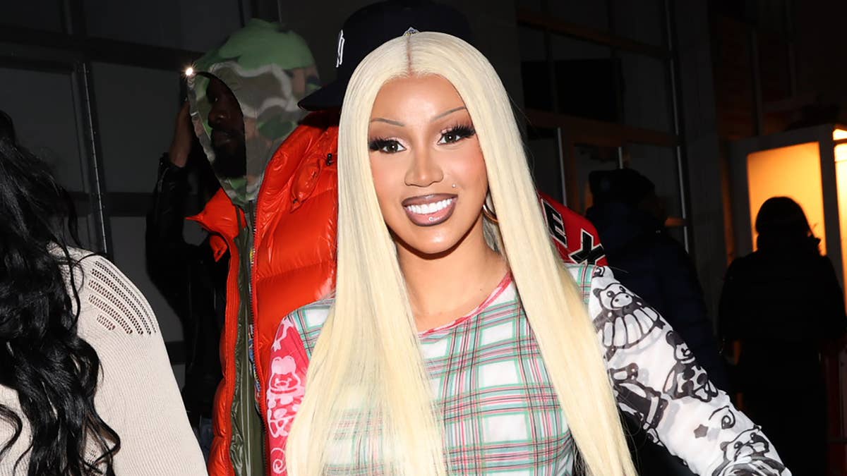 The rapper cleared the air after fans took issue with her dissing Coach bags on her latest song.