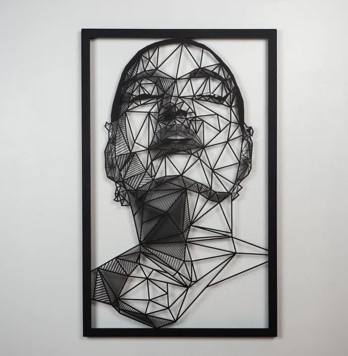 Geometric wireframe portrait of a face in abstract style, framed and mounted on a wall