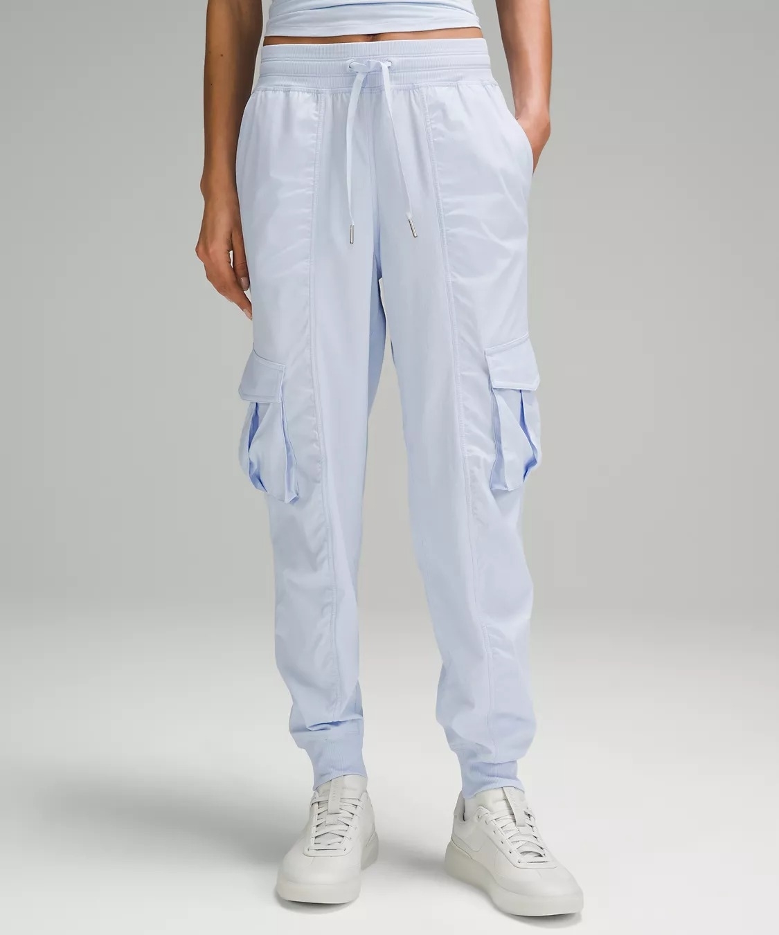 Model wearing blue dance-inspired cargo pants