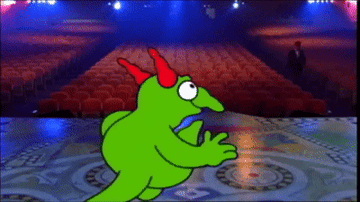 Animated character resembling a chicken performing on stage