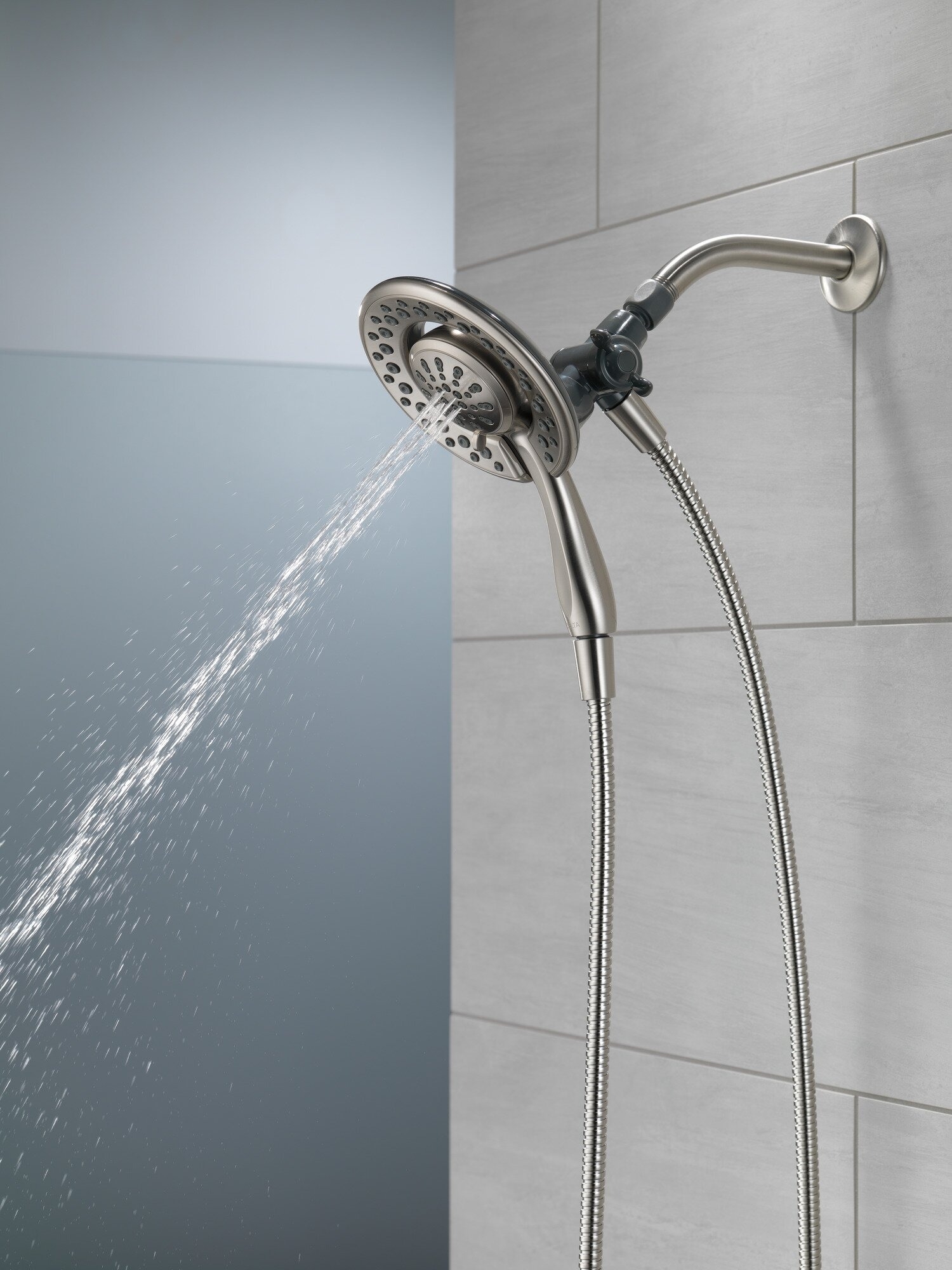 Showerhead with dual nozzles mounted in the shower