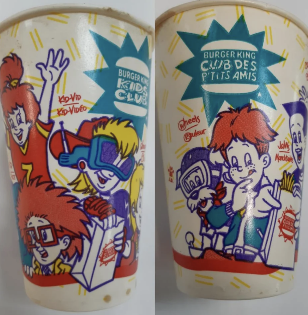 Kids&#x27; meal cup with illustrated Burger King Kids Club characters engaging with food and gadgets