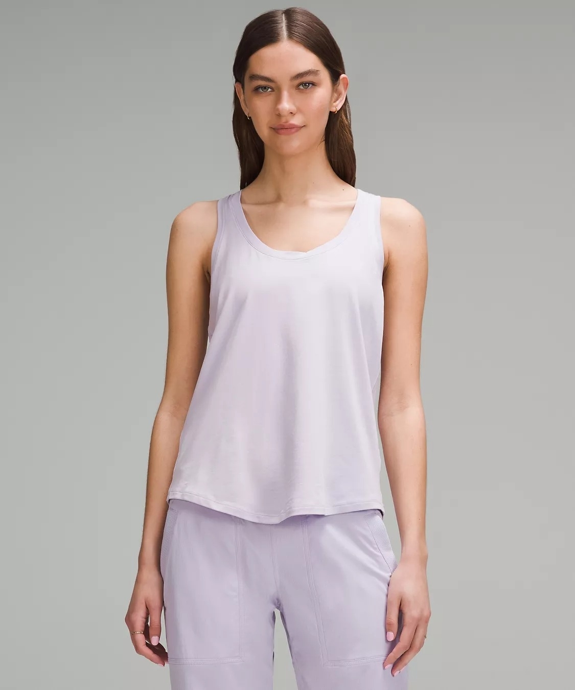 Model wearing light purple sleeveless workout tank