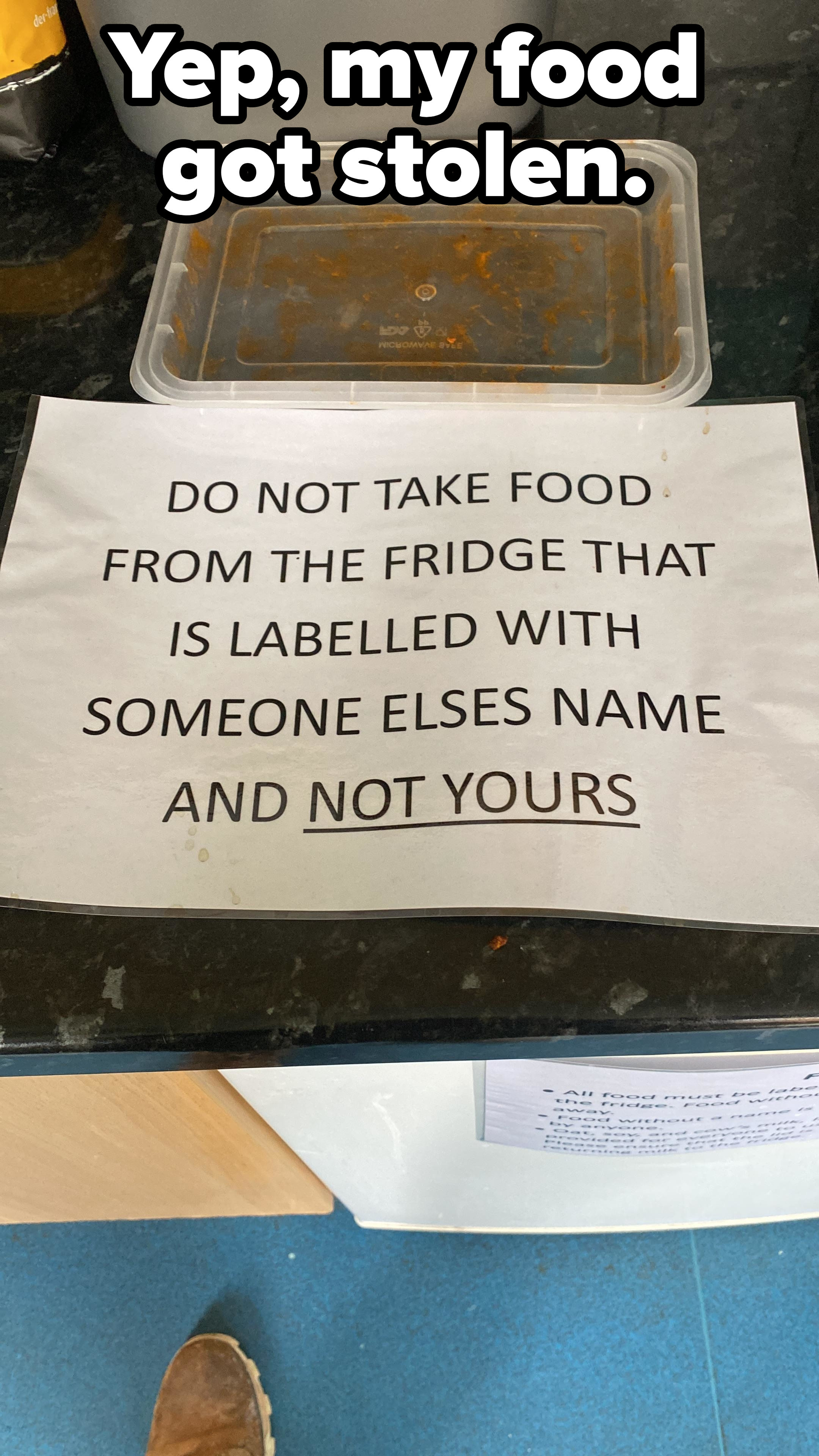 Sign in a fridge next to a plastic container top missing the bottom that reads, &quot;DO NOT TAKE FOOD FROM THE FRIDGE THAT IS LABELLED WITH SOMEONE ELSES NAME AND NOT YOURS&quot; with caption &quot;Yep, my food got stolen&quot;
