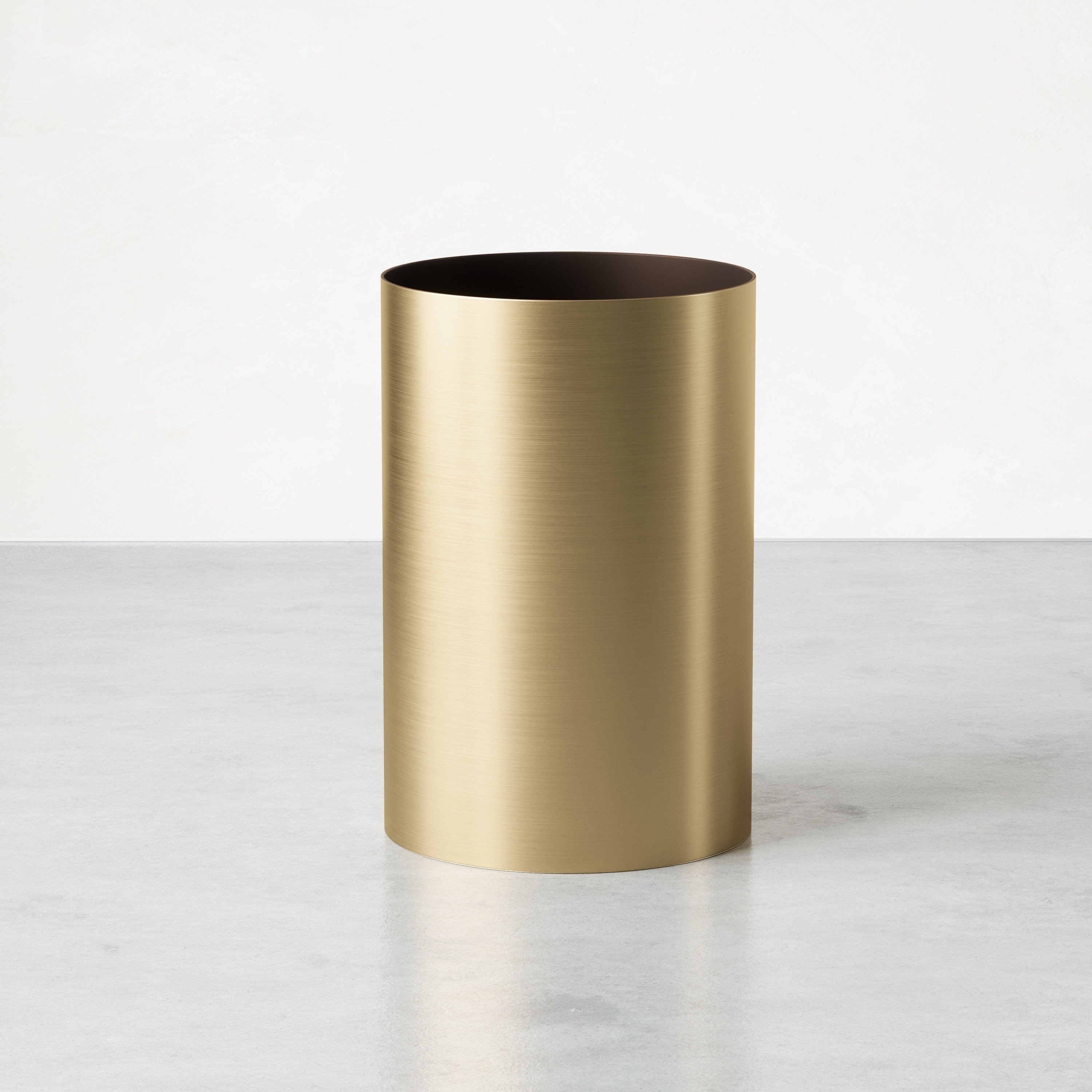 Brushed brass look cylindrical wastebasket