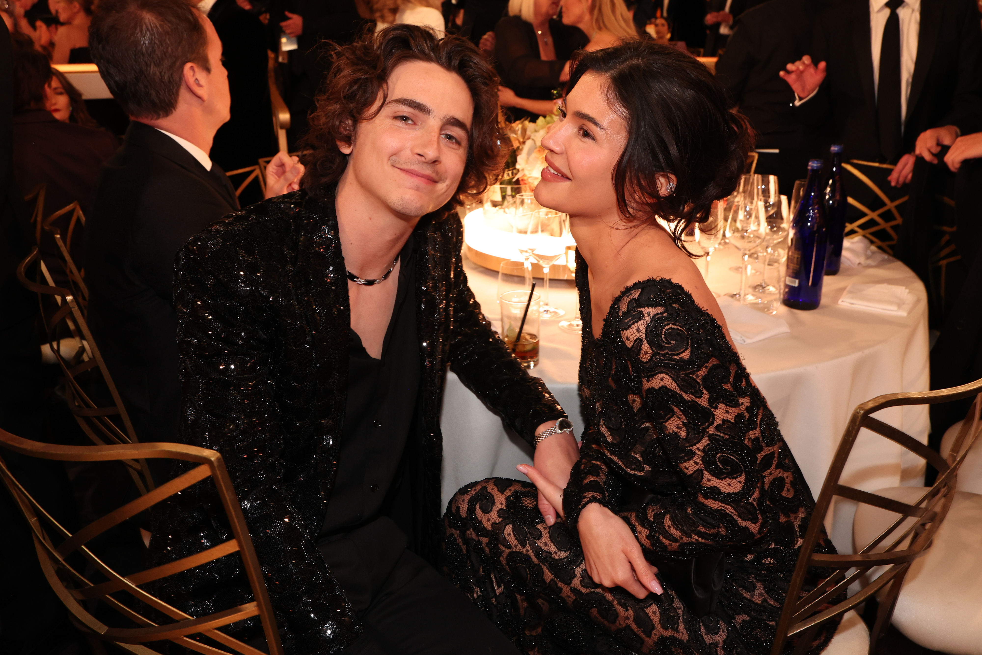 Timothée Chalamet and Kylie seated together at an event