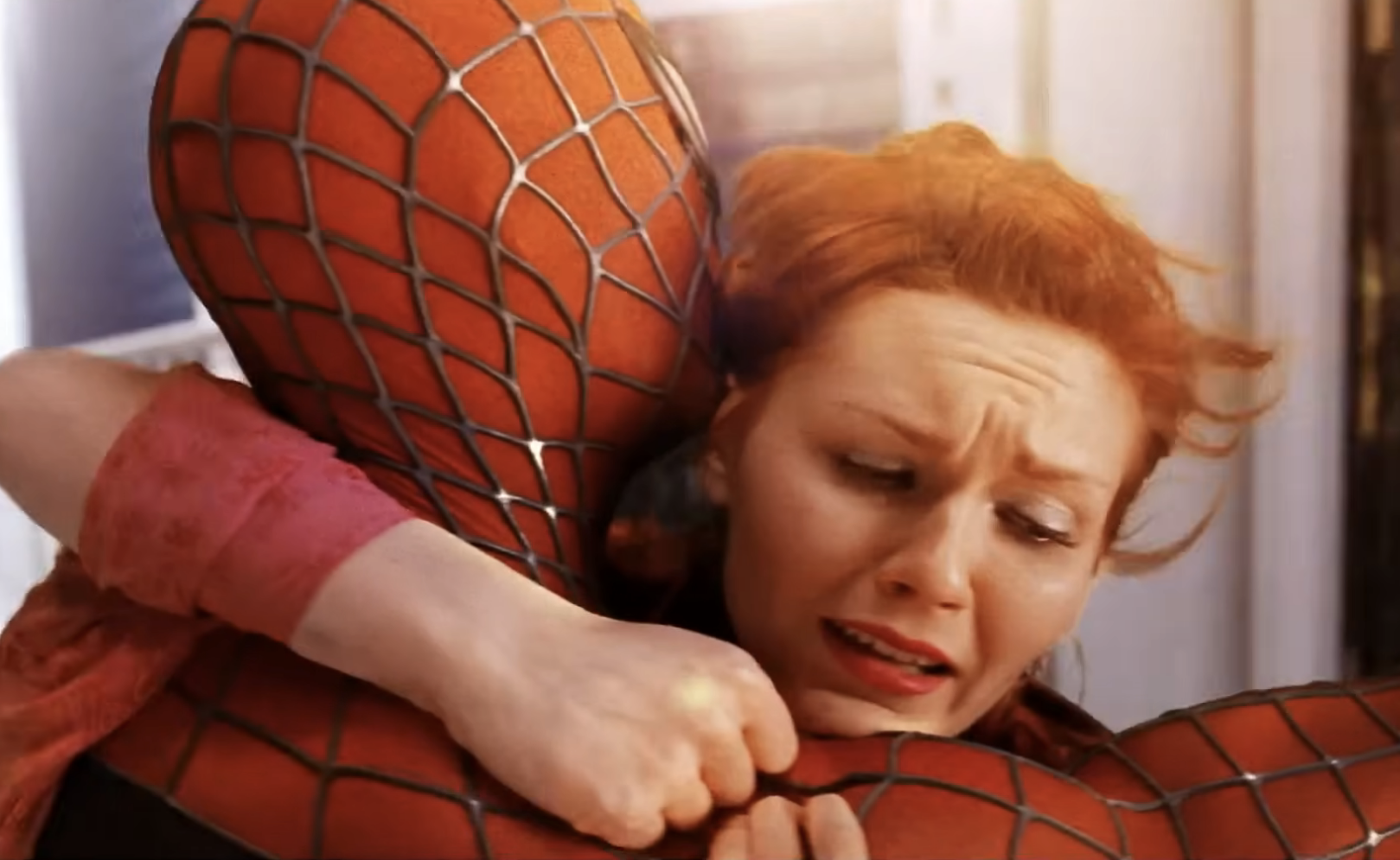 Tobey Maguire as Spider-Man holds Kirsten Dunst in a dramatic scene from the &quot;Spider-Man&quot; (2002) trailer