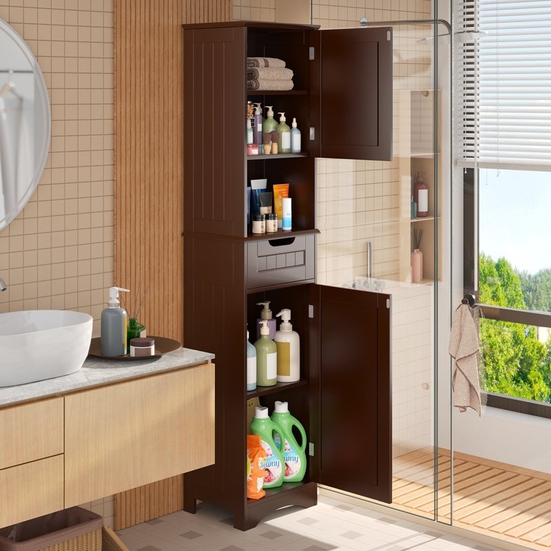 brown bathroom storage cabinet with shelves in a well-lit space