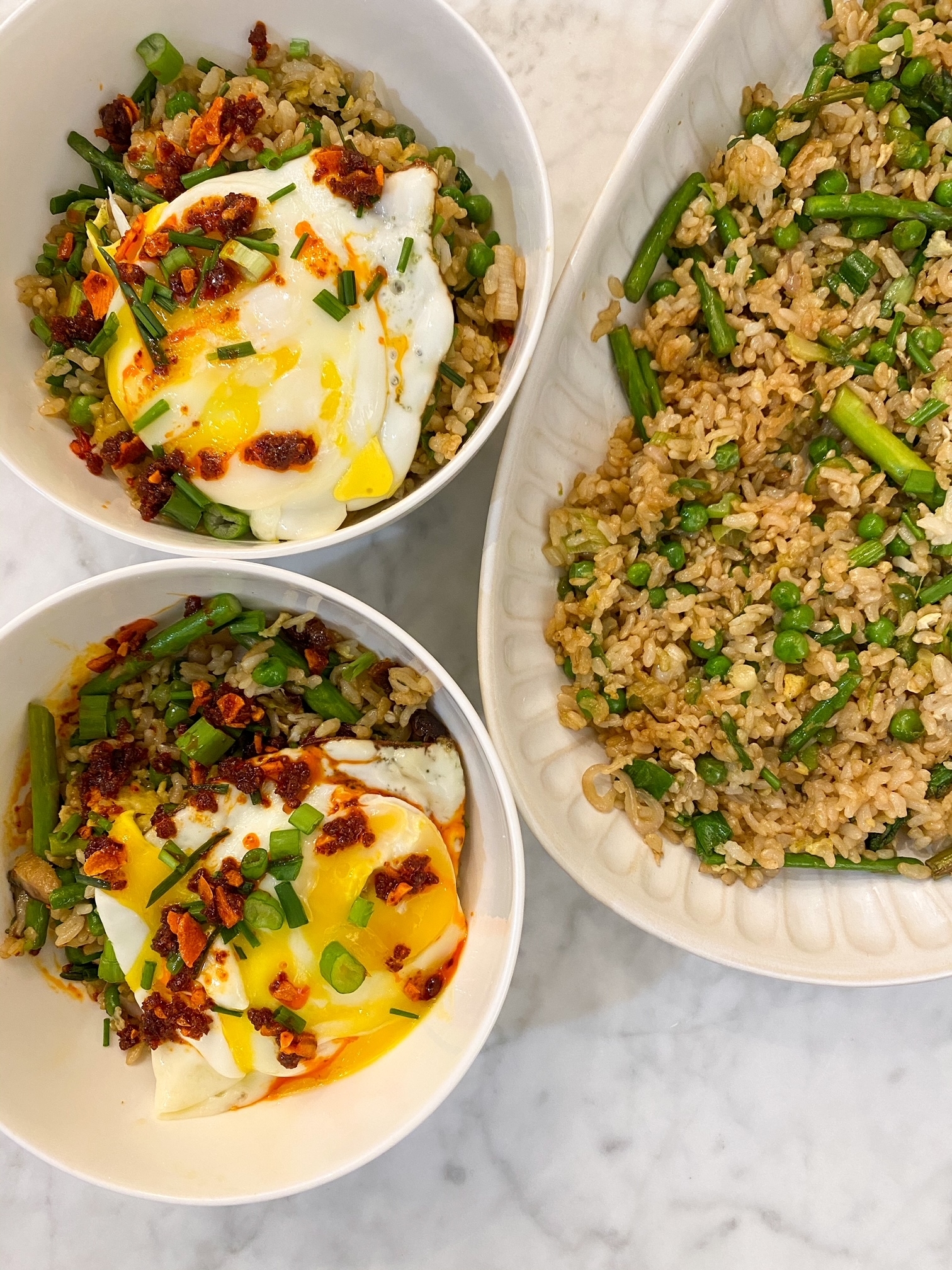 Bowls of fried rice topped with fried egg