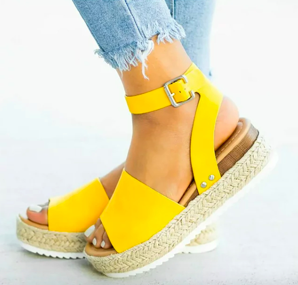 Model wearing the yellow wedges