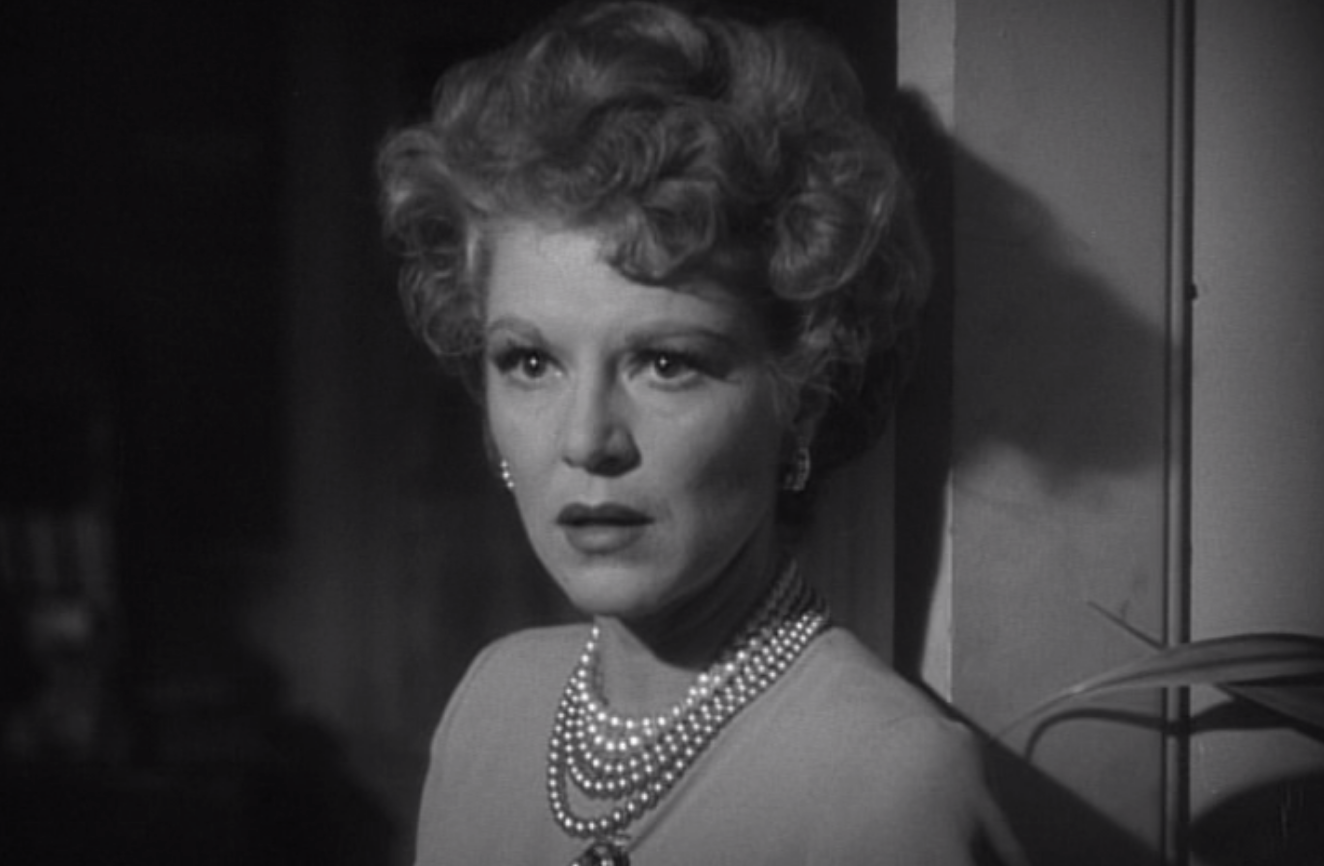 Close-up of a vintage movie character, a woman with an elegant hairstyle and pearl necklace