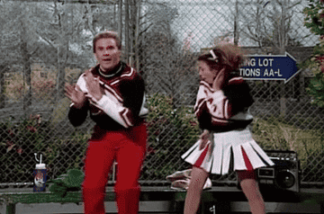 Will Ferrell and Sherri O&#x27;Terri dressed as cheerleaders doing a cheer