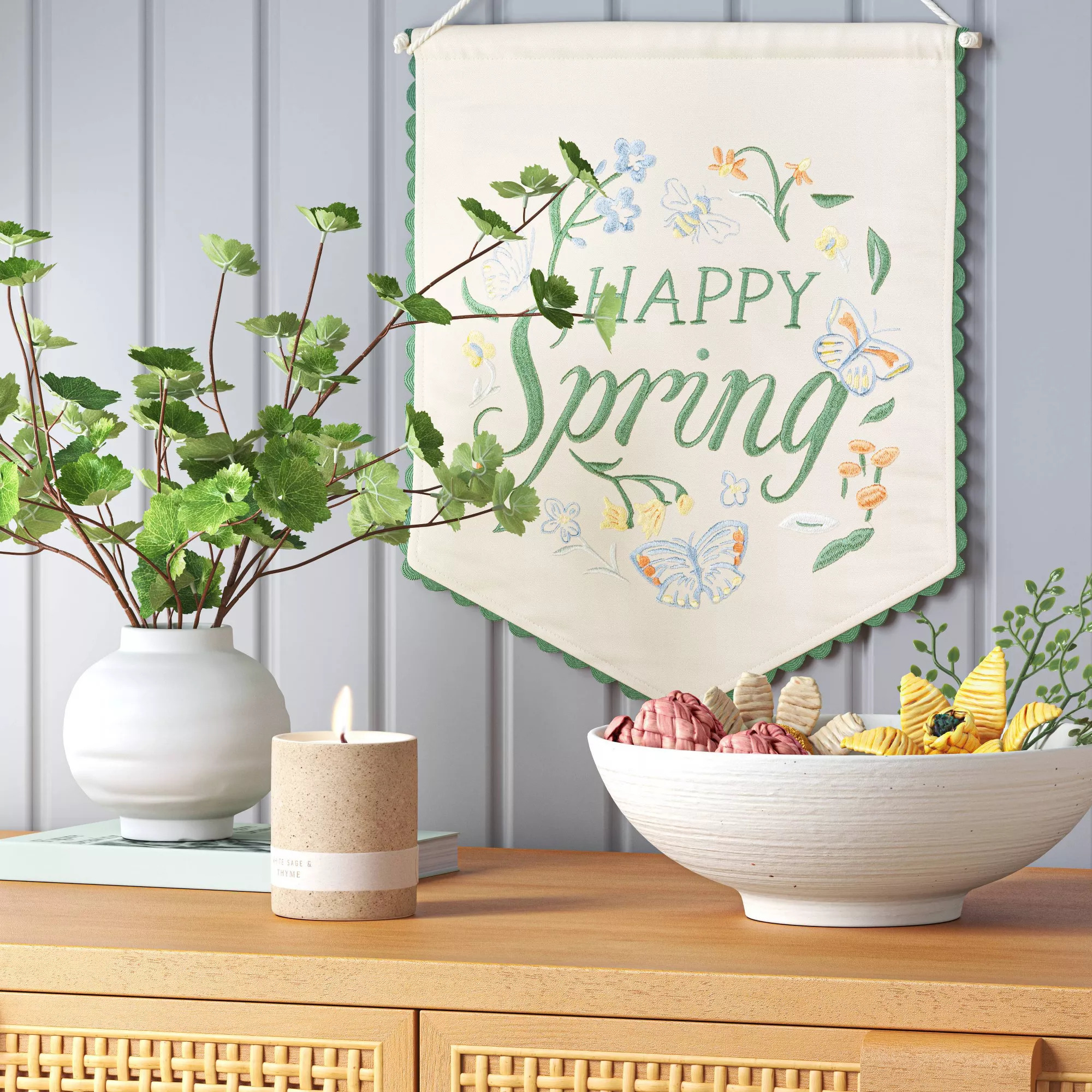 Banner with &quot;Happy Spring&quot; text, butterflies, and flowers decoration