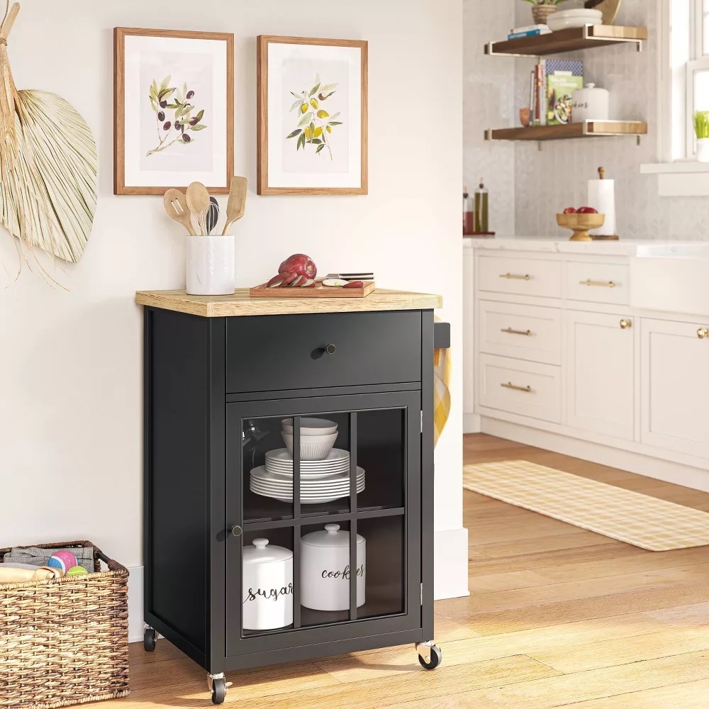 Kitchen cart with storage shelves and hanging utensils in a home environment, ideal for organizing kitchen space
