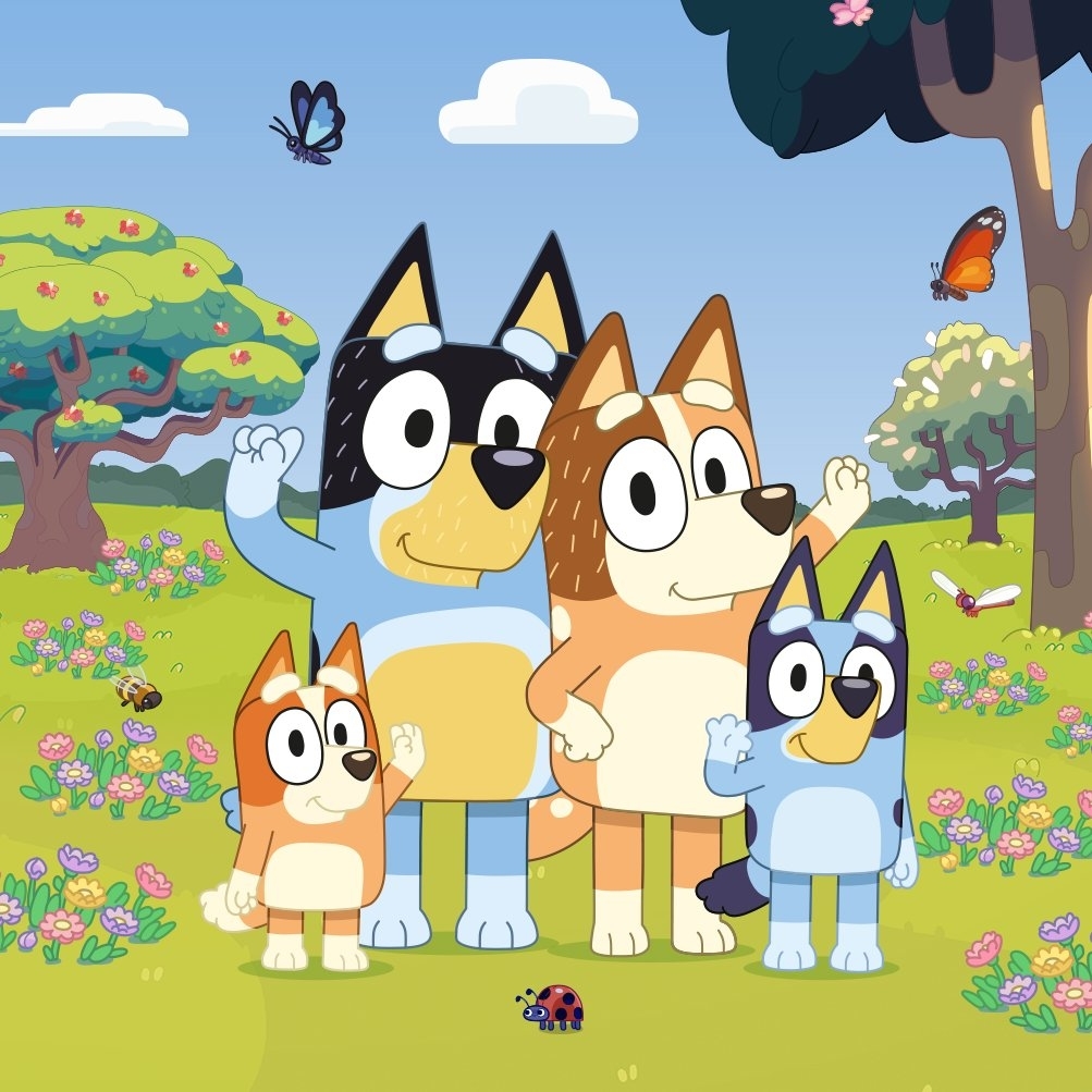Animated dog family with two adult dogs and two puppies in a sunny park