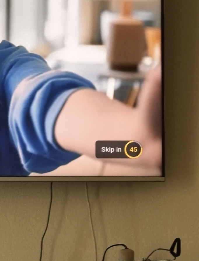 TV screen showing an ad with a &#x27;Skip in 45&#x27; seconds button
