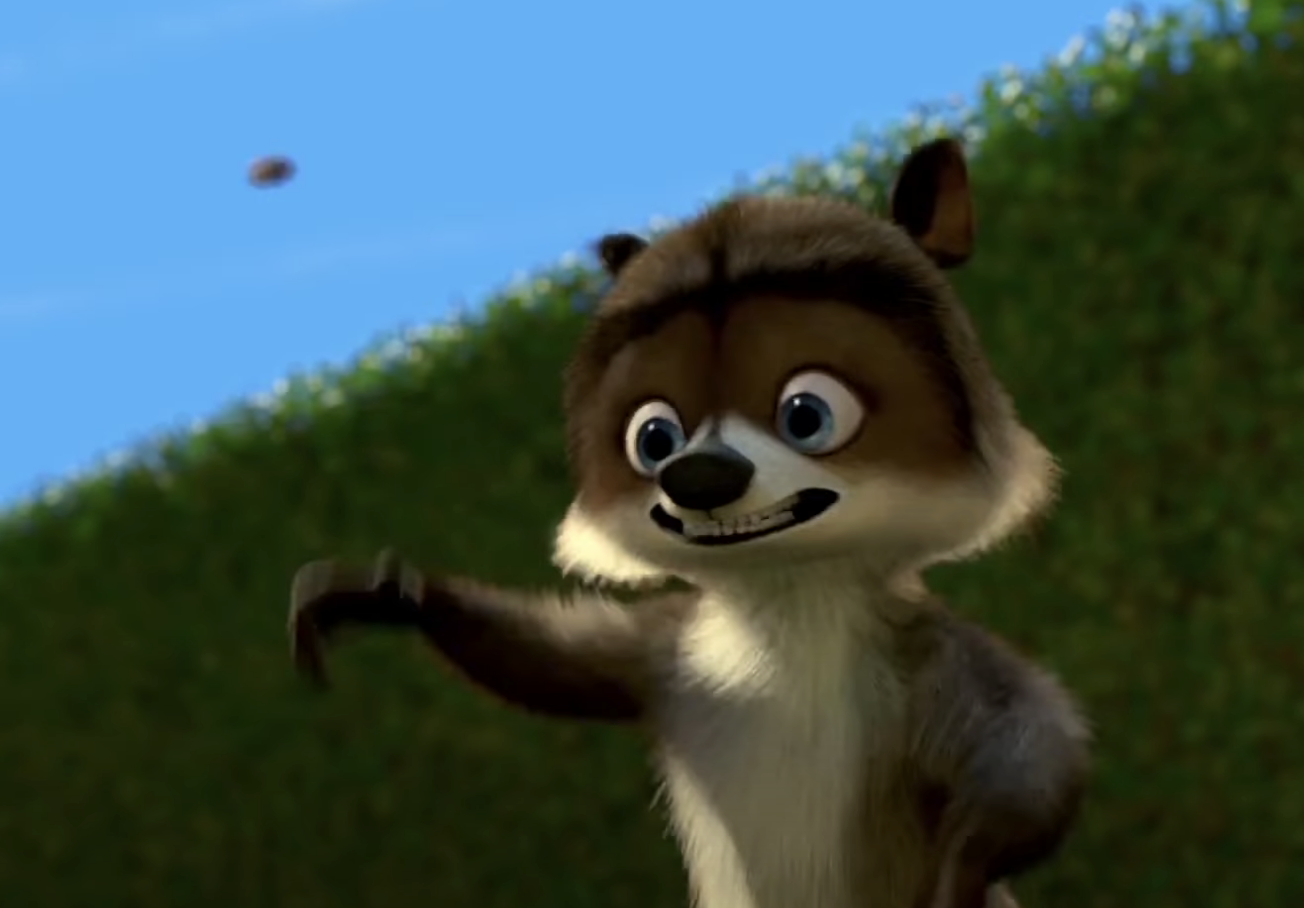 Animated character RJ from &quot;Over the Hedge&quot; looks at an object in the sky with his paw outstretched
