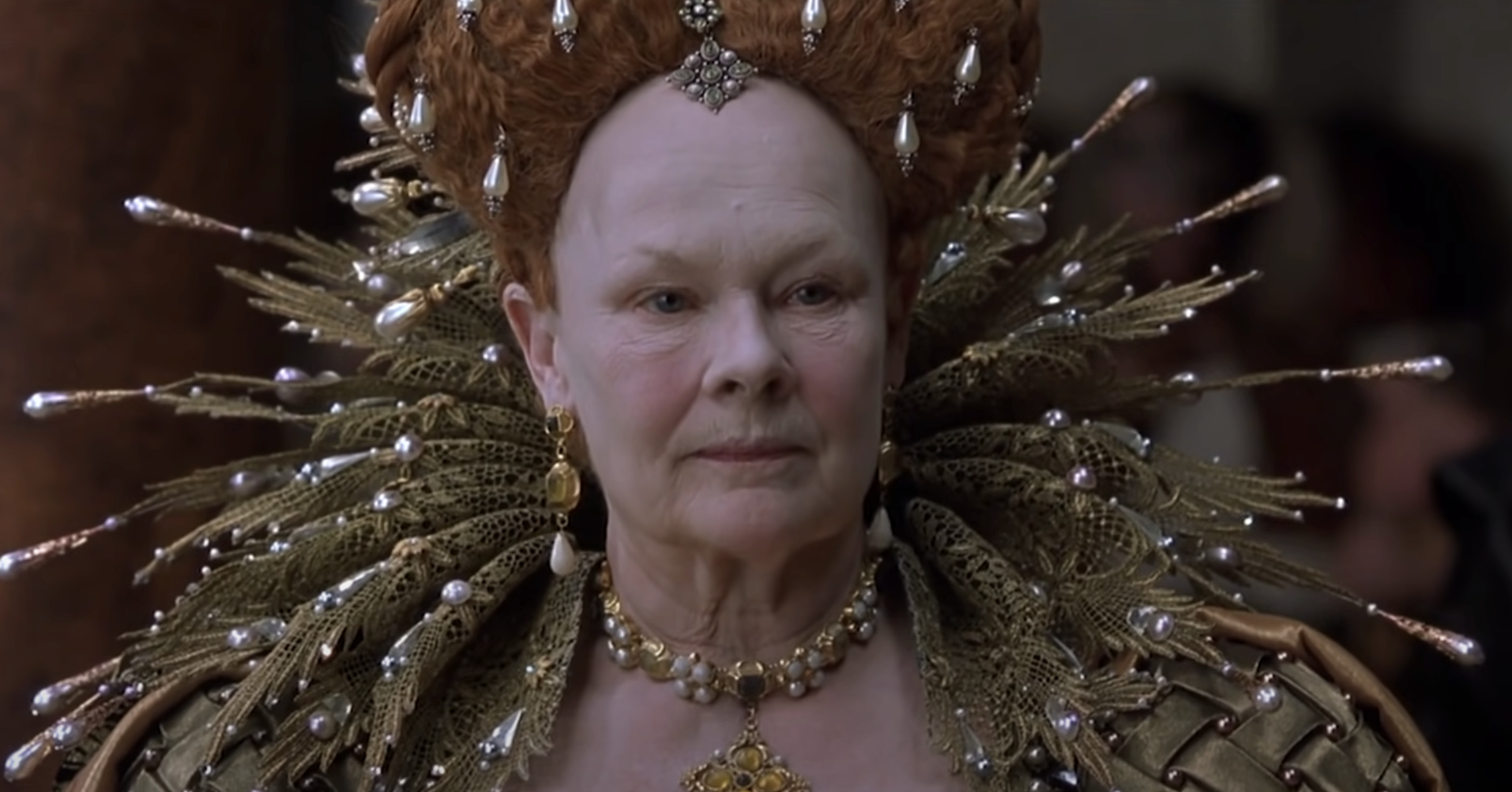 Queen Elizabeth I in ornate costume with ruff and jeweled headpiece