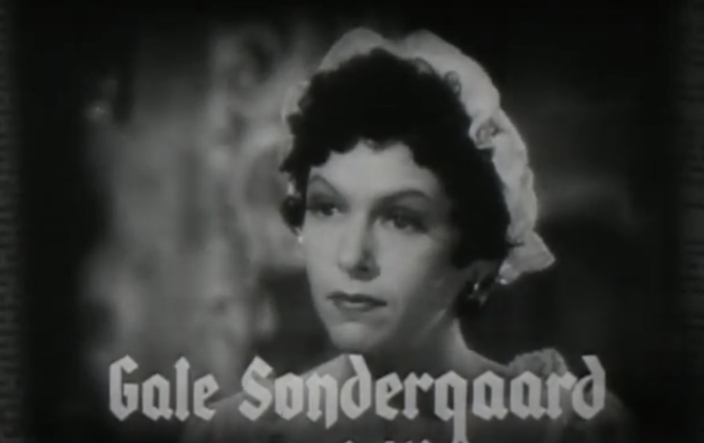 Actress Gale Sondergaard in a vintage film still, wearing a bonnet and looking to the side