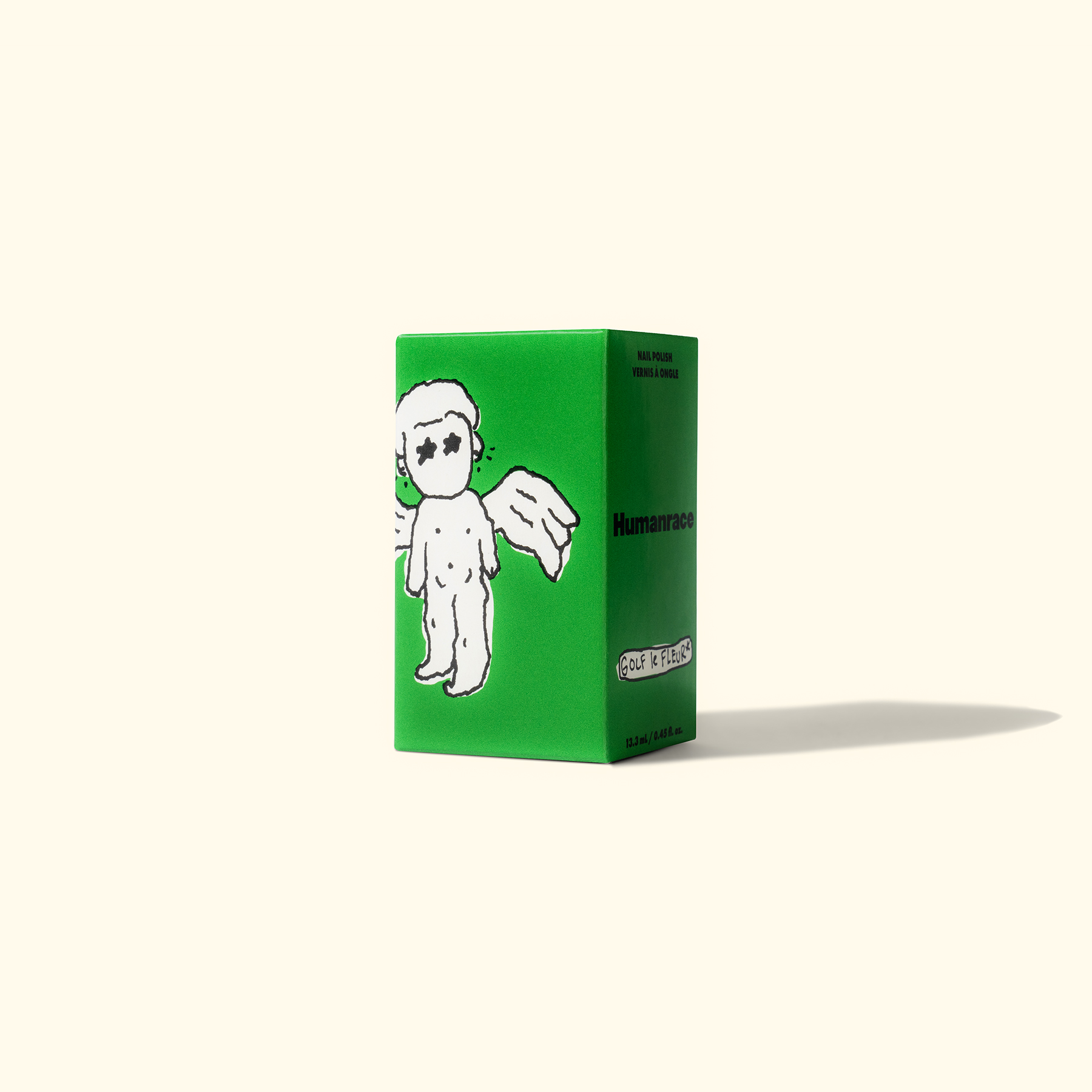 A green shoebox with an illustrated character on the side, part of the Humanrace collaboration