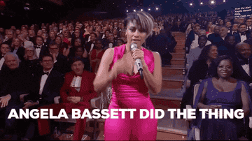 Ariana DeBose dancing and singing "Angela Bassett did the thing" at an awards show, in the middle of an aisle