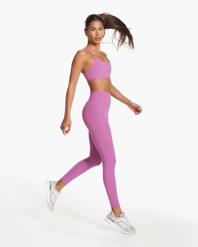Model wearing high-rise workout leggings
