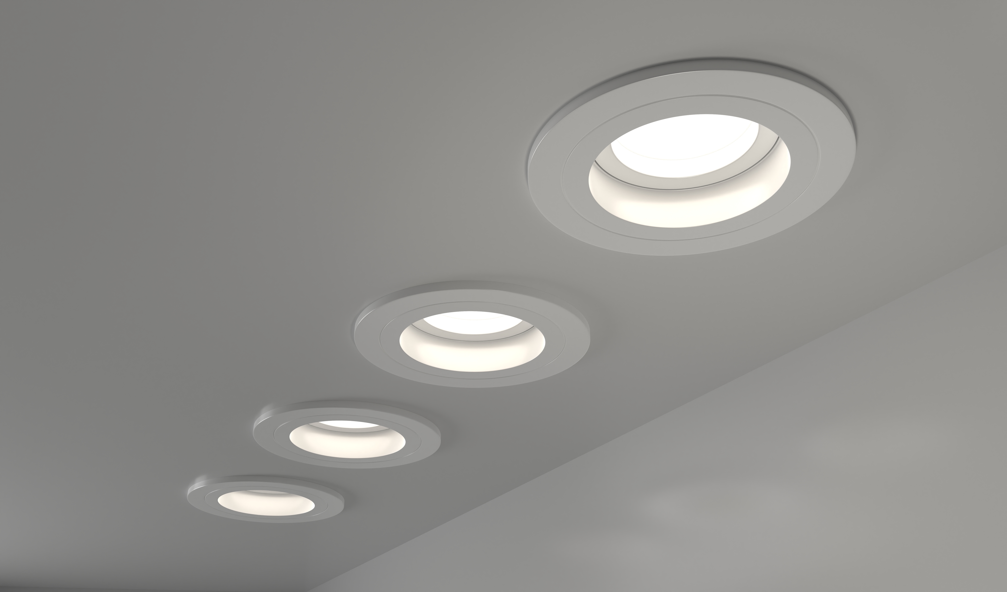 Five recessed lighting fixtures set in a ceiling, providing interior illumination