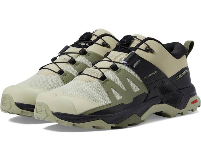 Pair of Salomon hiking boots with laces, designed for outdoor activities