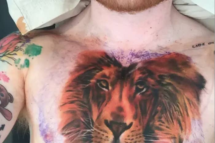 Lion tattoo on Ed&#x27;s chest with a vibrant mane extending to shoulders