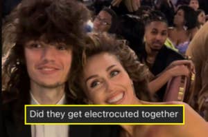 Two people smiling with tousled hair, humorous caption questioning their hairdo origins