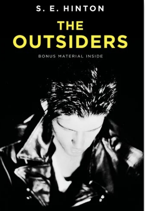 Cover of &quot;The Outsiders&quot; by S.E. Hinton, featuring a person in a leather jacket