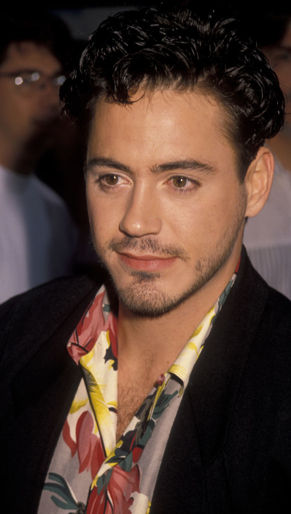 Robert Downey Jr. wearing a floral shirt under a jacket, at a public event