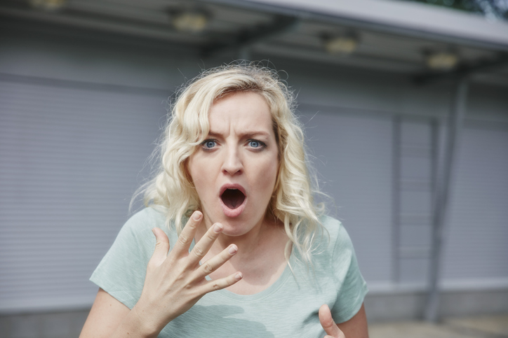 Person expressing shock with wide eyes and open mouth