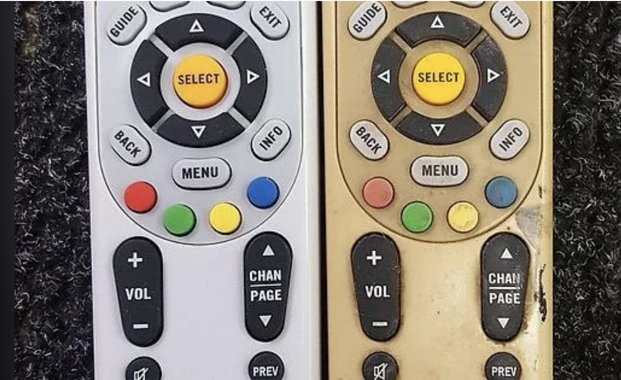 Two television remotes side by side, one clean and the other covered with grime