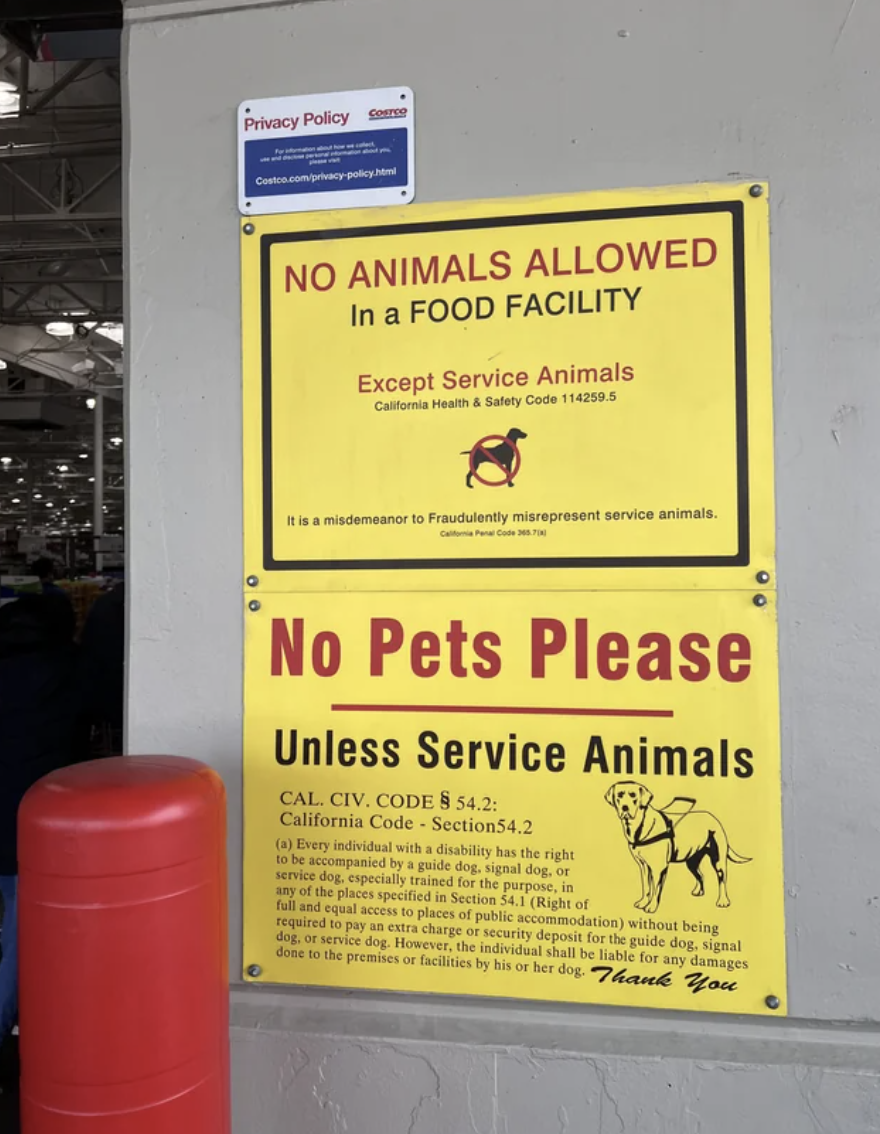 Sign reads &quot;No Animals Allowed in a Food Facility&quot; exception for service animals, citing California health codes