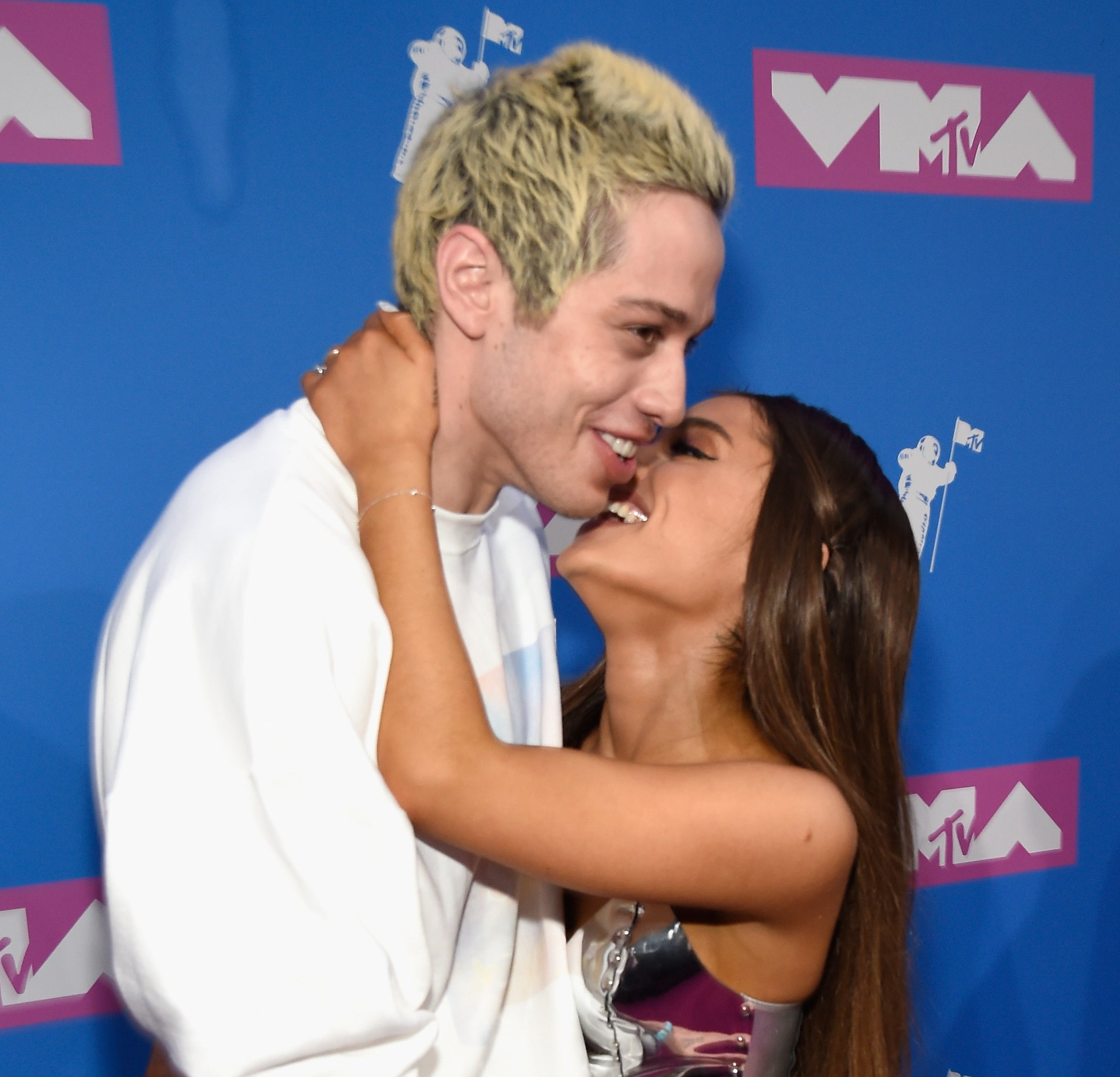 Pete Davidson and Ariana Grande share a hug at the VMAs